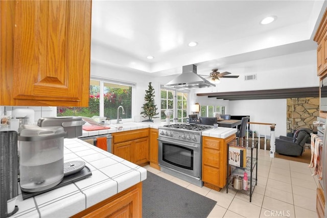 2871 N Wyngate Rd, Orange, CA 92867 - kitchen featuring appliances with stainless steel finishes, a sink, tile counters, a wealth of natural light, and visible vents