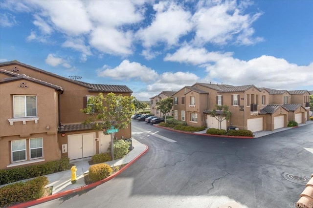 view of road featuring curbs and a residential view