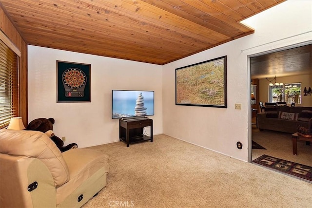 carpeted living area featuring a notable chandelier and wood ceiling