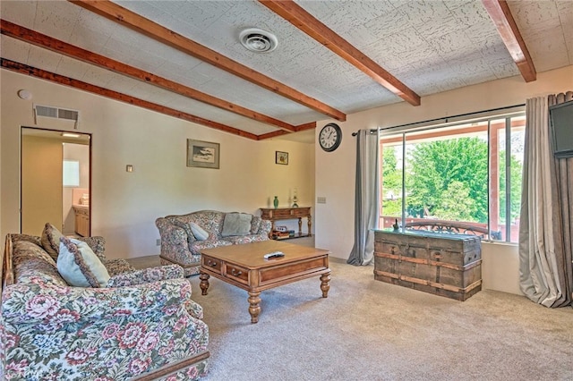 carpeted living room featuring visible vents and lofted ceiling with beams