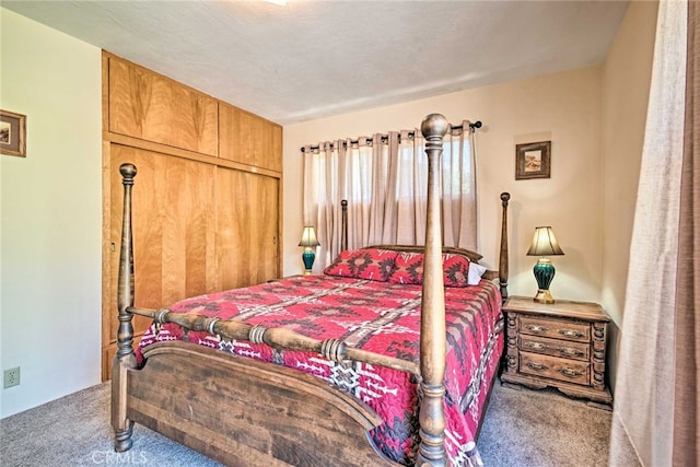 bedroom with a closet and carpet flooring