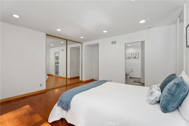 2018 Palisades Dr, Fullerton, CA 92831 - bedroom featuring recessed lighting, ensuite bath, visible vents, baseboards, and wood finished floors