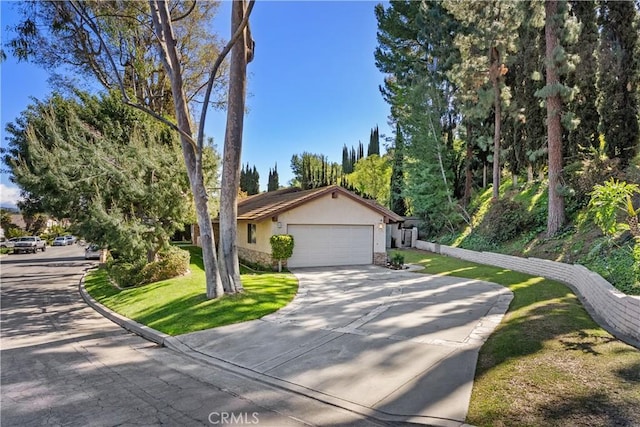 2018 Palisades Dr, Fullerton, CA 92831 - single story home featuring a front yard, stucco siding, driveway, stone siding, and an attached garage