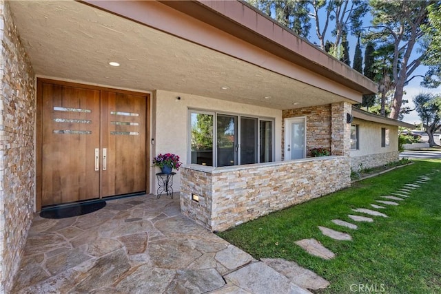 2018 Palisades Dr, Fullerton, CA 92831 - entrance to property featuring stucco siding, a lawn, and stone siding