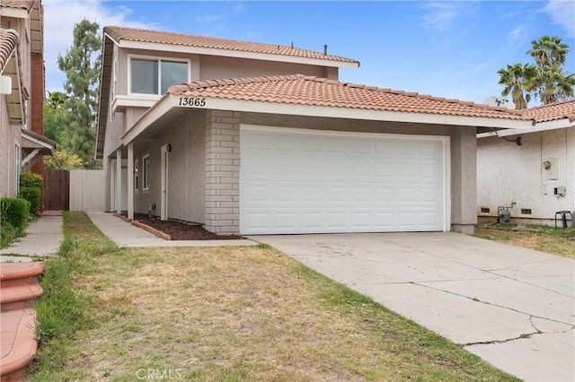 view of front facade featuring fence, concrete driveway, an attached garage, and a tile roof