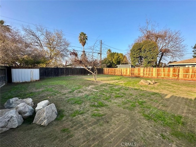 view of yard with a fenced backyard