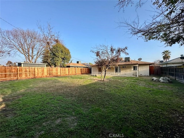 view of yard with a fenced backyard