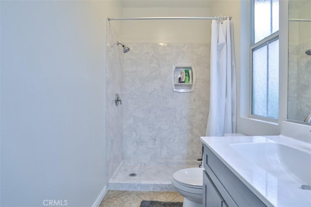 full bathroom with toilet, vanity, a shower with shower curtain, and tile patterned flooring