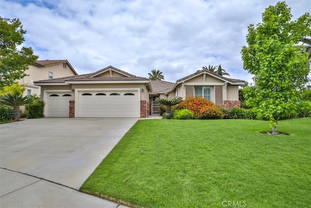ranch-style home with a front yard, a garage, driveway, brick siding, and stucco siding