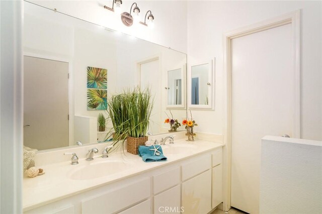 4752 Tiara Dr Unit 103, Huntington Beach, CA 92649 - bathroom featuring double vanity