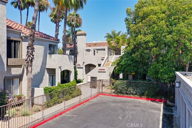 4752 Tiara Dr Unit 103, Huntington Beach, CA 92649 - view of building exterior with a residential view
