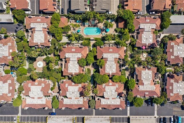 4752 Tiara Dr Unit 103, Huntington Beach, CA 92649 - aerial view of property and surrounding area with nearby suburban area and a pool