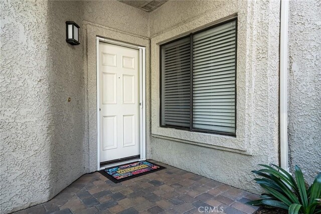 4752 Tiara Dr Unit 103, Huntington Beach, CA 92649 - entrance to property with stucco siding