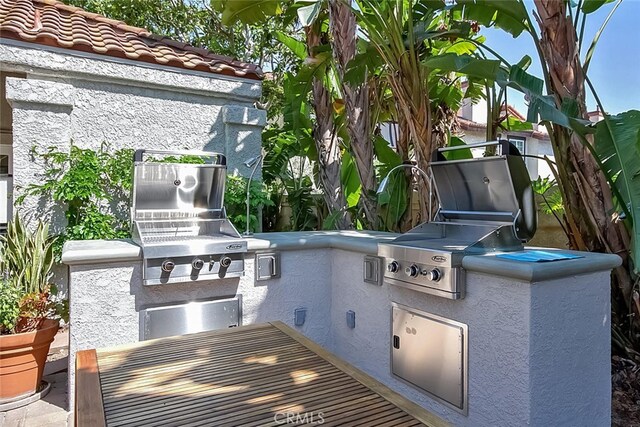 4752 Tiara Dr Unit 103, Huntington Beach, CA 92649 - view of patio featuring area for grilling