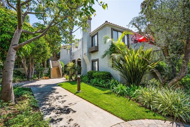 4752 Tiara Dr Unit 103, Huntington Beach, CA 92649 - view of property's community with stairway and a lawn