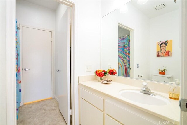 4752 Tiara Dr Unit 103, Huntington Beach, CA 92649 - bathroom featuring vanity and tile patterned floors