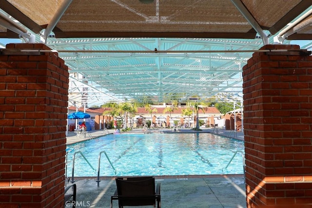 3243 San Amadeo Unit 2H, Laguna Woods, CA 92637 - view of swimming pool with a patio and a fenced in pool