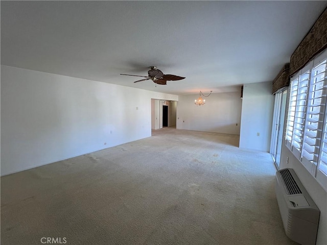 3243 San Amadeo Unit 2H, Laguna Woods, CA 92637 - empty room with light colored carpet and ceiling fan with notable chandelier