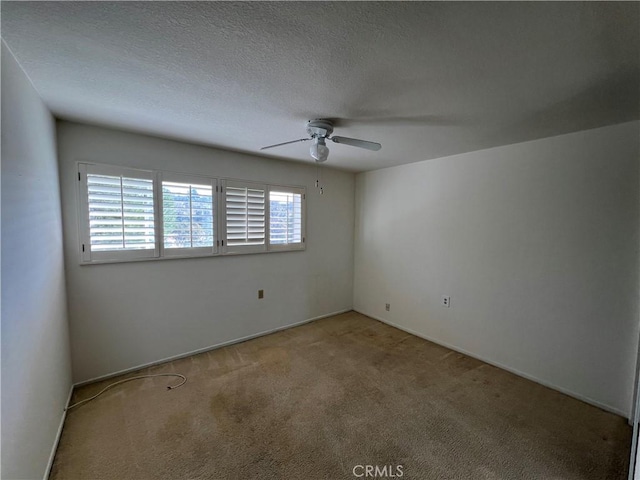 3243 San Amadeo Unit 2H, Laguna Woods, CA 92637 - spare room with a ceiling fan and carpet floors