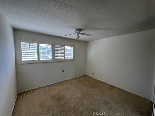 3243 San Amadeo Unit 2H, Laguna Woods, CA 92637 - spare room featuring a ceiling fan and carpet floors