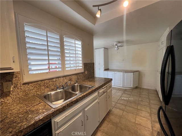 3243 San Amadeo Unit 2H, Laguna Woods, CA 92637 - kitchen featuring black appliances, backsplash, white cabinets, and a sink