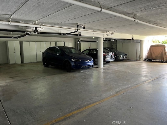 3243 San Amadeo Unit 2H, Laguna Woods, CA 92637 - parking deck with a garage door opener
