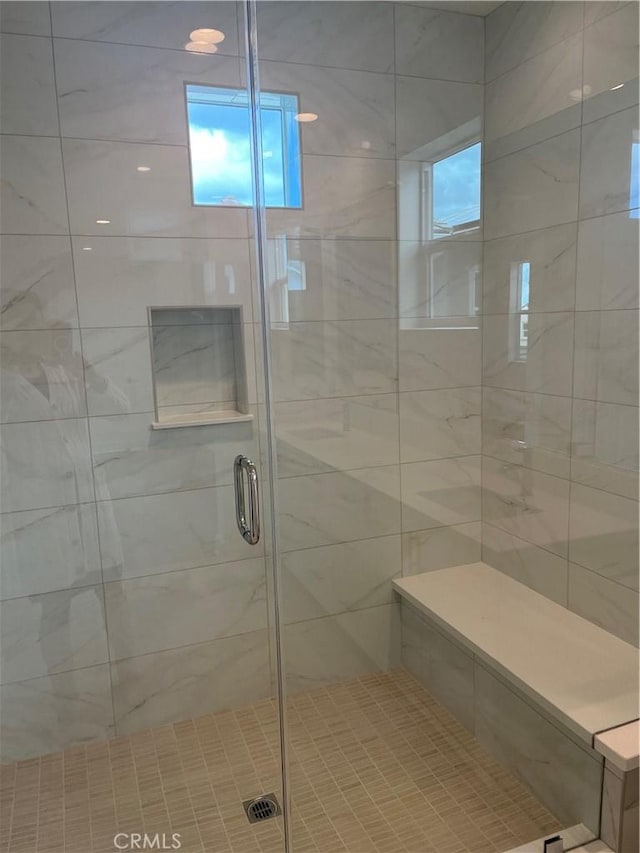bathroom featuring a shower stall