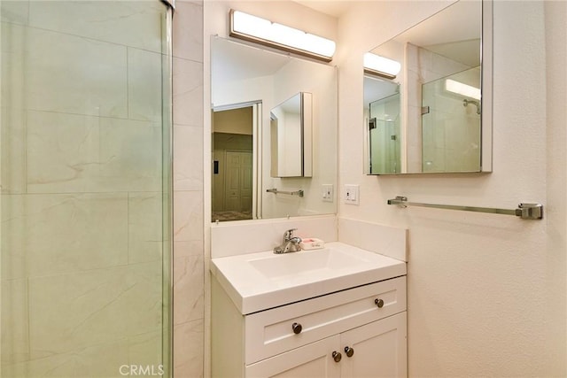 bathroom with vanity and a stall shower