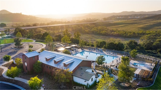 birds eye view of property featuring a mountain view