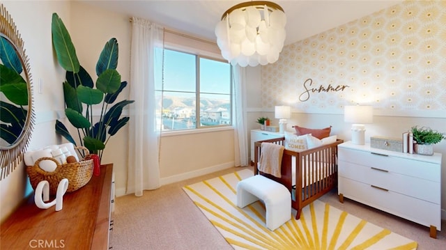 bedroom with baseboards, light carpet, a notable chandelier, and multiple windows
