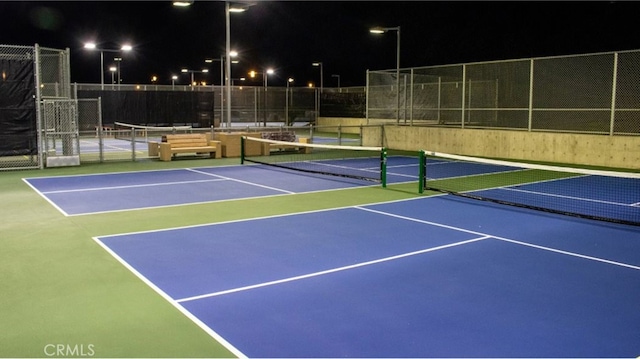 view of sport court featuring fence and community basketball court