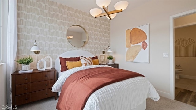 bedroom with carpet, wallpapered walls, and baseboards