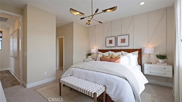 bedroom featuring visible vents, baseboards, a notable chandelier, and carpet floors