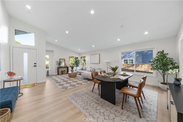 dining area with recessed lighting, baseboards, vaulted ceiling, and light wood-style floors