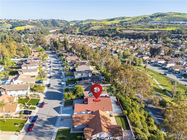 birds eye view of property featuring a mountain view and a residential view