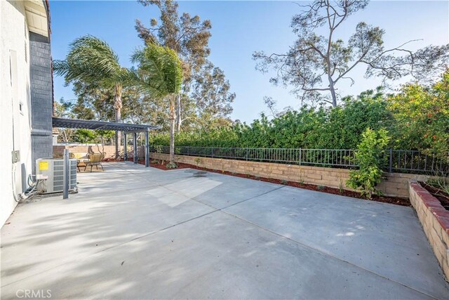 view of patio / terrace featuring a fenced backyard and central AC unit