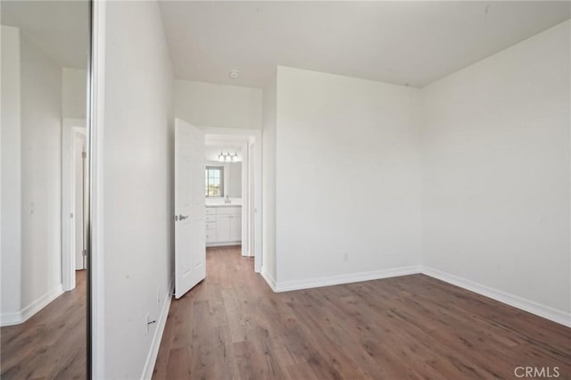 28846 Yosemite Pl, Canyon Lake, CA 92587 - unfurnished bedroom featuring wood finished floors and baseboards