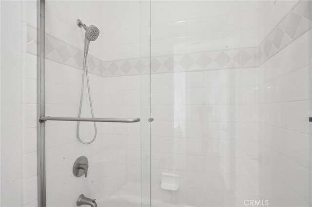 28846 Yosemite Pl, Canyon Lake, CA 92587 - bathroom featuring bath / shower combo with glass door