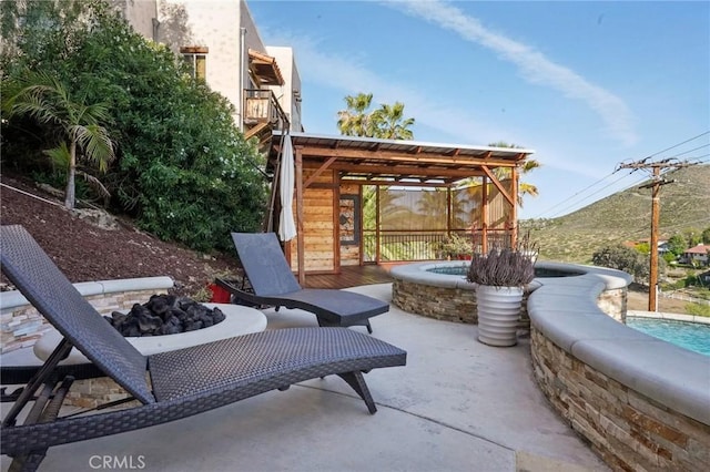 28846 Yosemite Pl, Canyon Lake, CA 92587 - view of patio featuring a fire pit and an in-ground hot tub