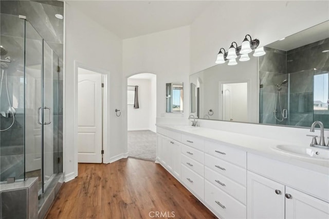 28846 Yosemite Pl, Canyon Lake, CA 92587 - full bath with a shower stall, double vanity, and wood finished floors