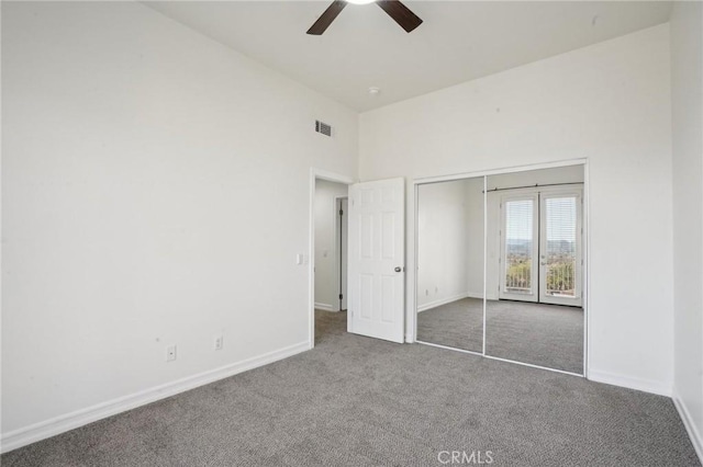 28846 Yosemite Pl, Canyon Lake, CA 92587 - unfurnished bedroom with carpet floors, a ceiling fan, a closet, and a towering ceiling