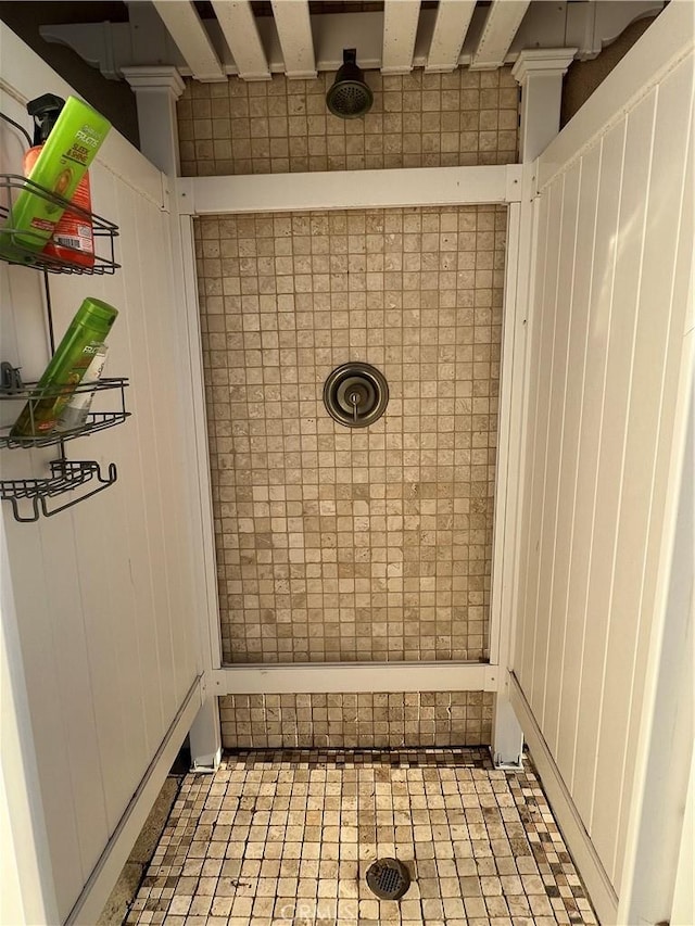 full bath with a tile shower