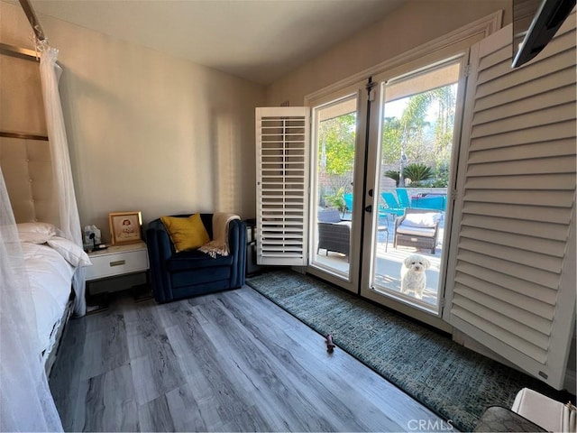 interior space featuring access to exterior and wood finished floors