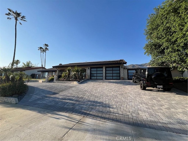 view of front of property featuring an attached garage and driveway