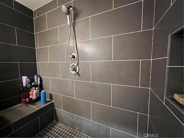 full bath featuring tiled shower