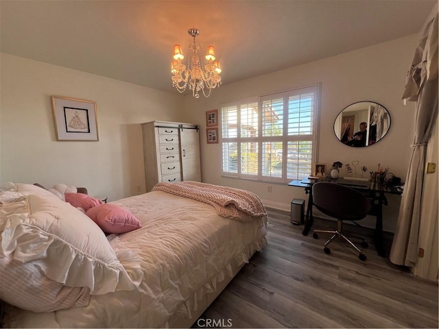 bedroom with baseboards, a notable chandelier, and dark wood-type flooring