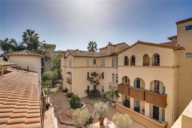 5935 Playa Vista Dr Unit 307, Playa Vista, CA 90094 - exterior space with a tiled roof, a chimney, and stucco siding