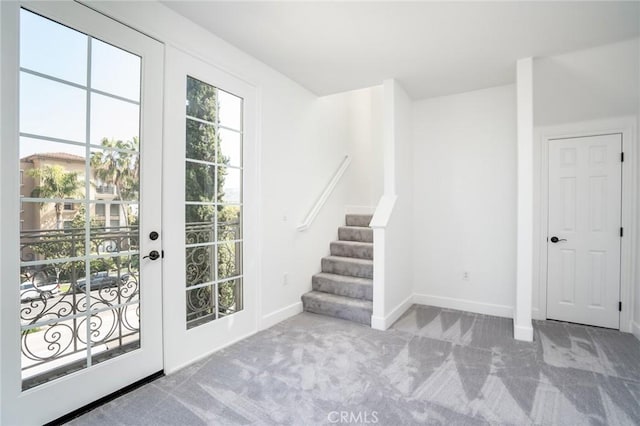 5935 Playa Vista Dr Unit 307, Playa Vista, CA 90094 - doorway to outside with carpet flooring, baseboards, and stairway