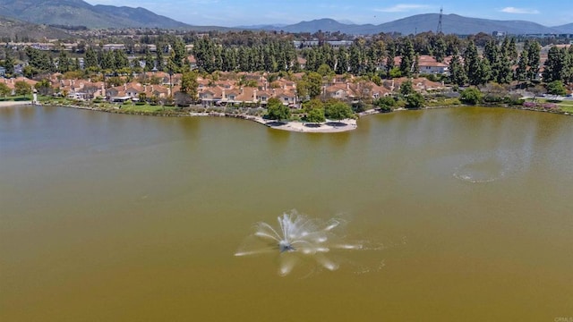 aerial view featuring a residential view and a water and mountain view