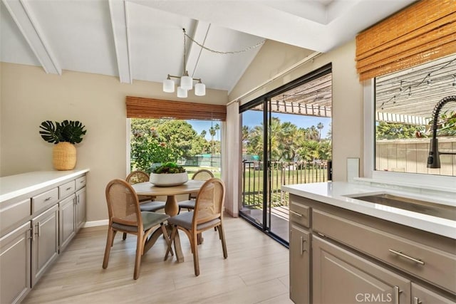 74 Tennis Club Dr, Rancho Mirage, CA 92270 - sunroom / solarium with beam ceiling, plenty of natural light, and a sink